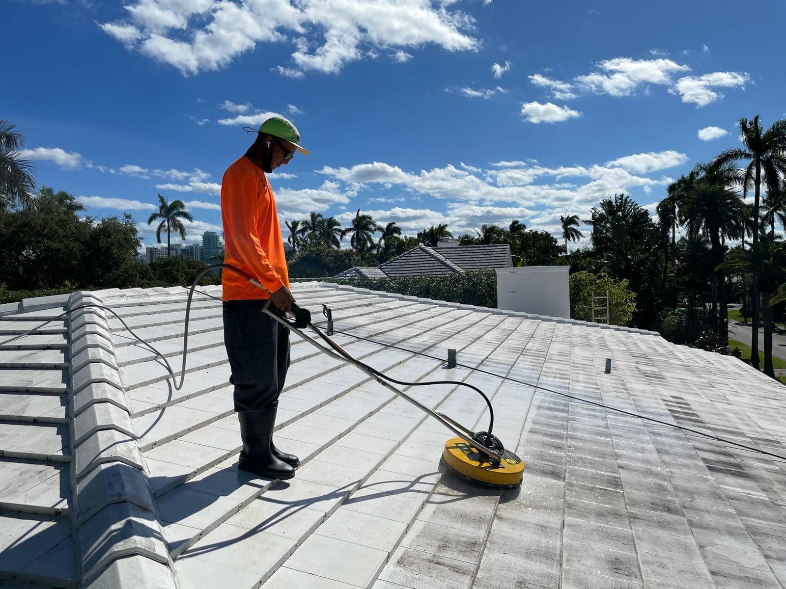 Crew soft washing a flat roof — Finesse Cleaning, South Florida