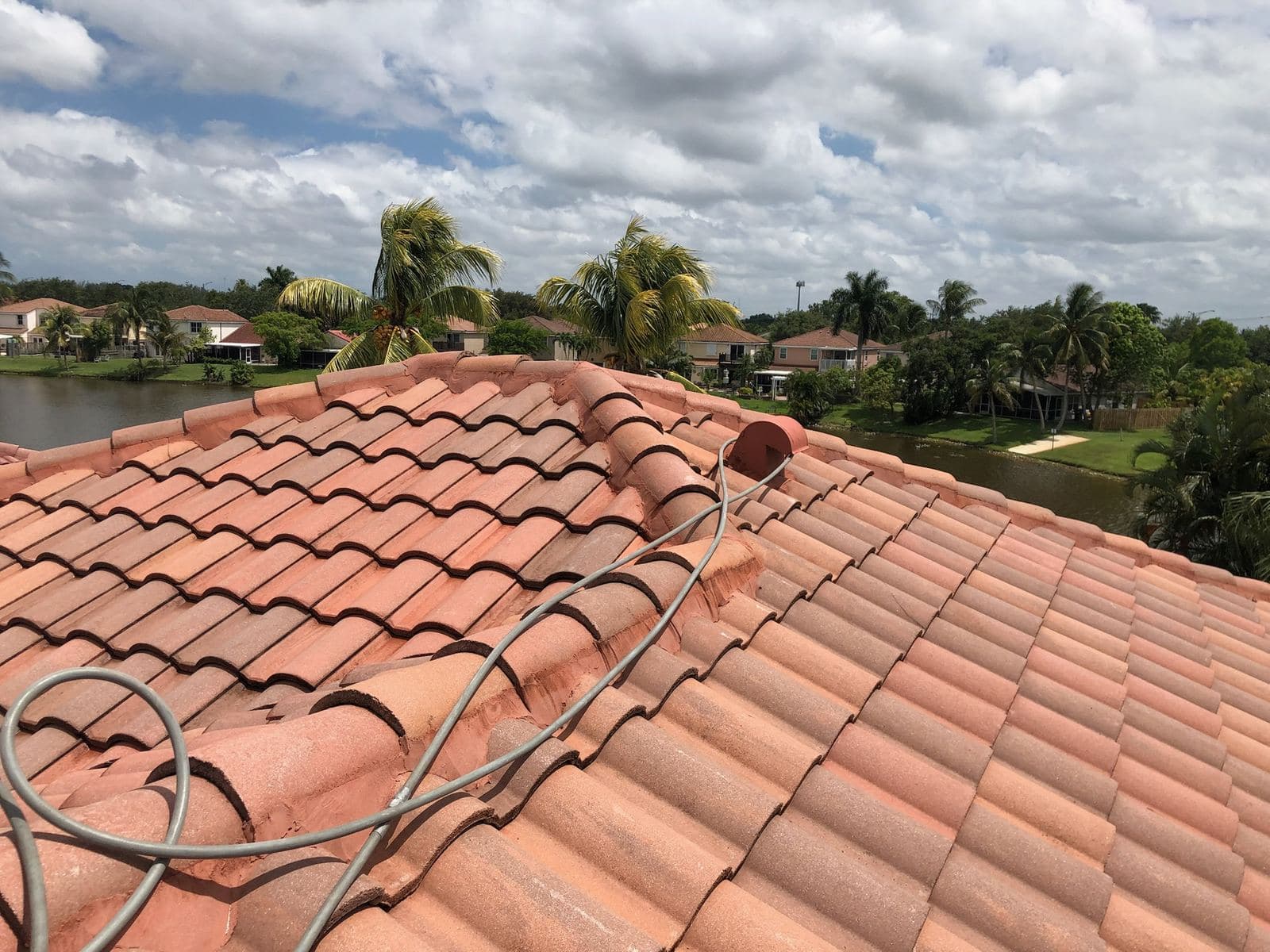 Aerial view of a clean tile roof — Finesse Cleaning, South Florida