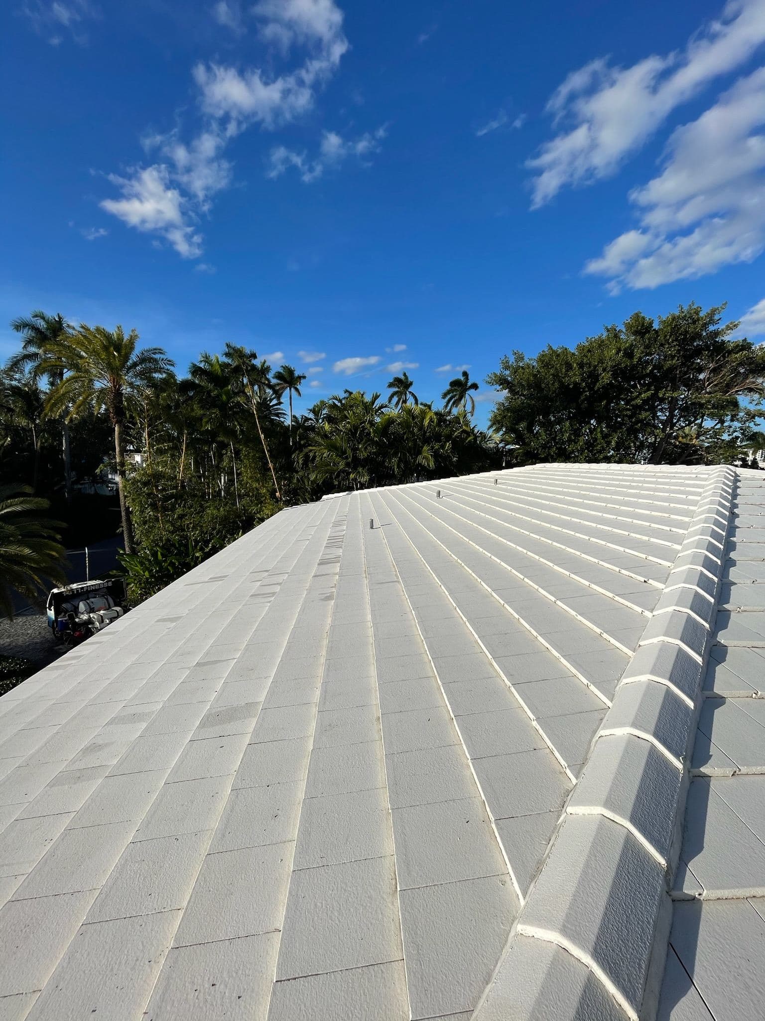 Wide view of a flat roof after soft washing — Finesse Cleaning, South Florida